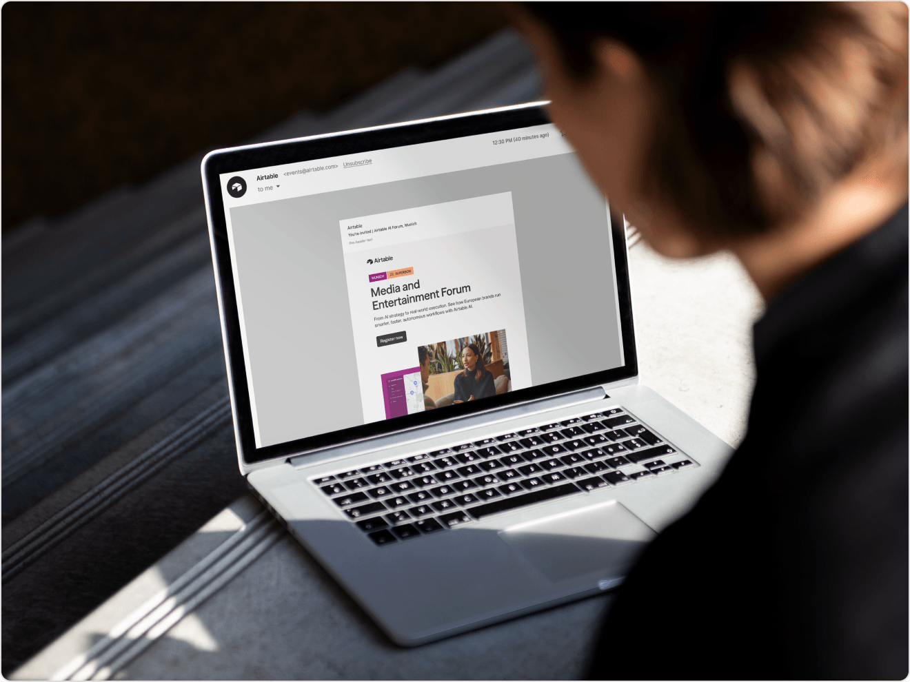 An event invitation displayed on a laptop