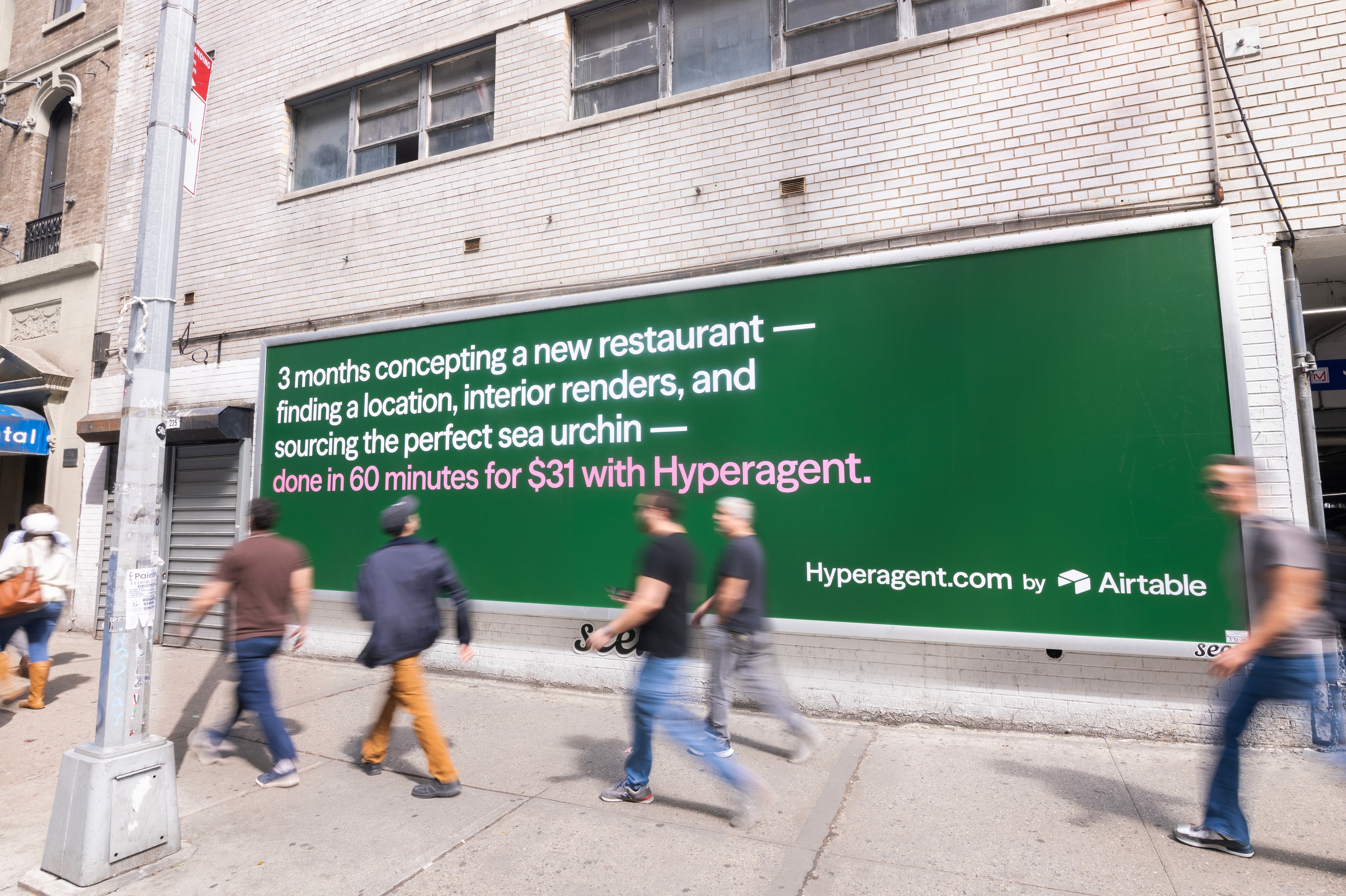 Hyperagent hand-painted campaign on a building